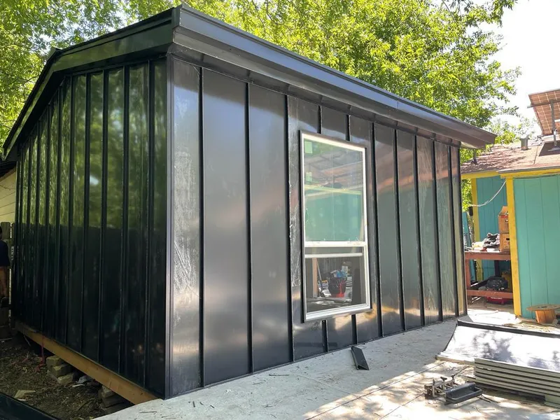 Black standing seam metal wall panels for Metal Roof Installation in Floresville